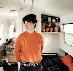 a woman in a orange sweater